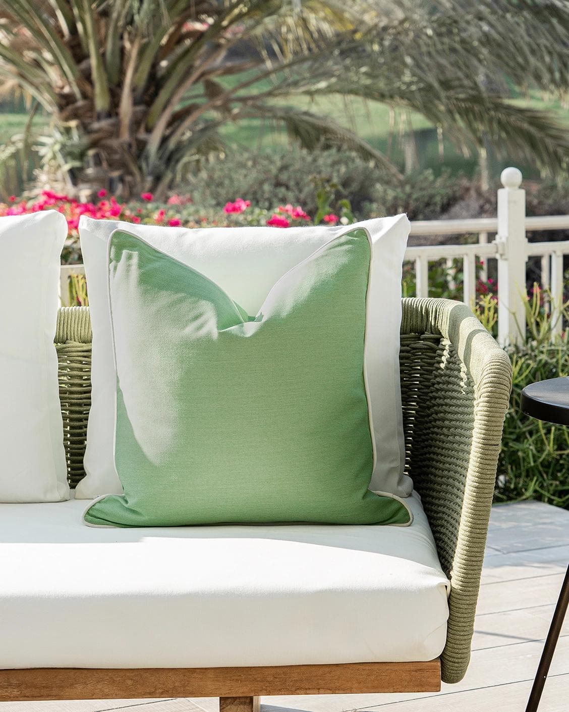 Aelia Fern cushion in forest green and green, shown in a lifestyle front view as image 4