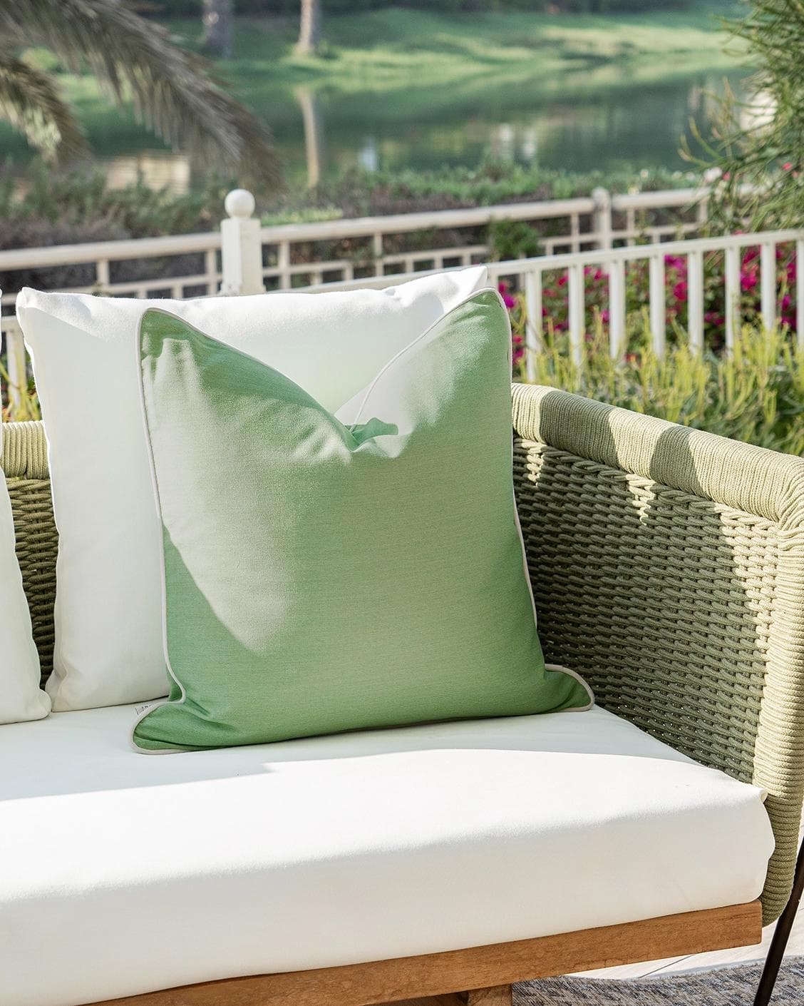 Aelia Fern cushion in forest green and green, shown in a lifestyle left view as image 2