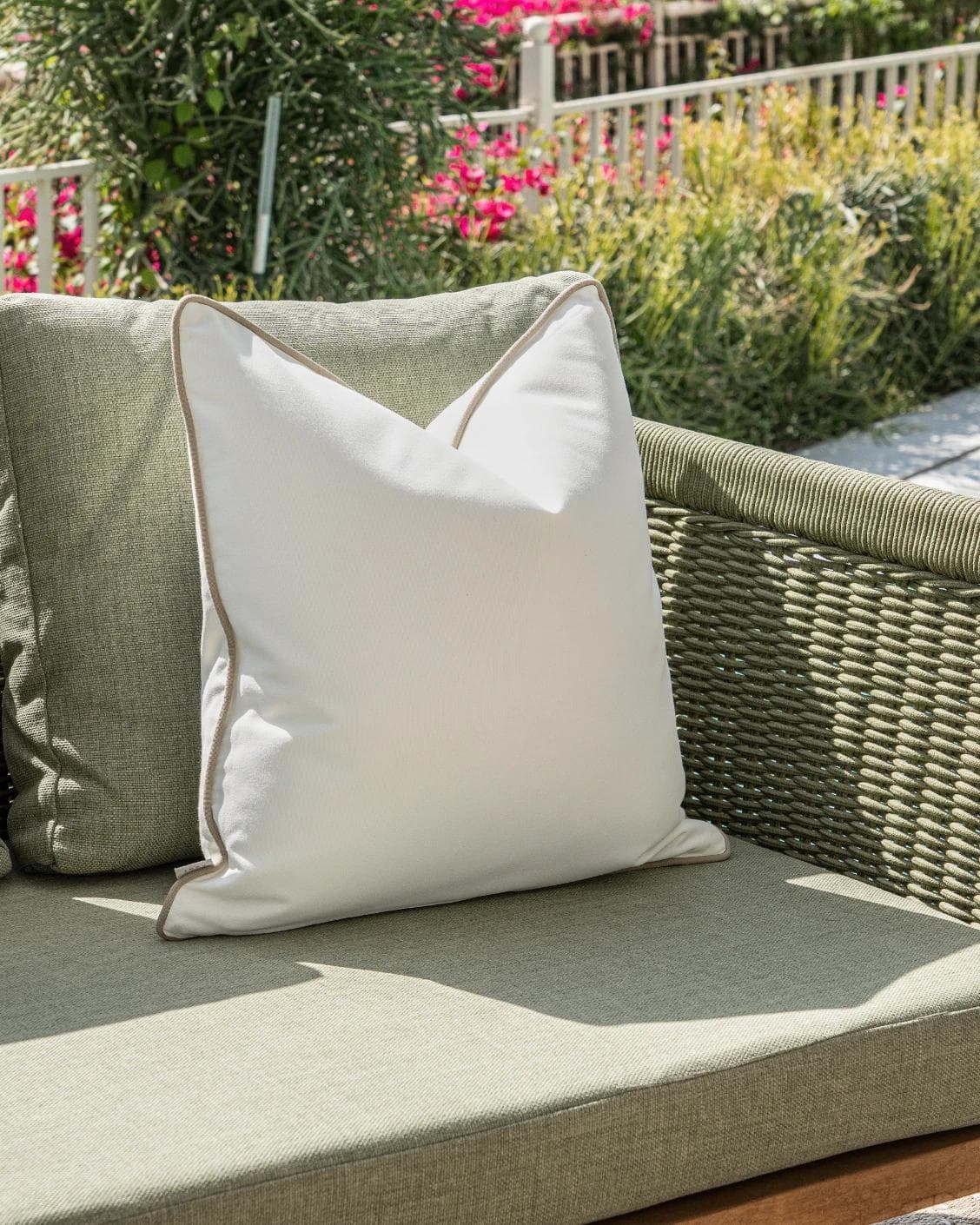 Aelia Linen cushion in ivory, shown in a lifestyle left view as image 2