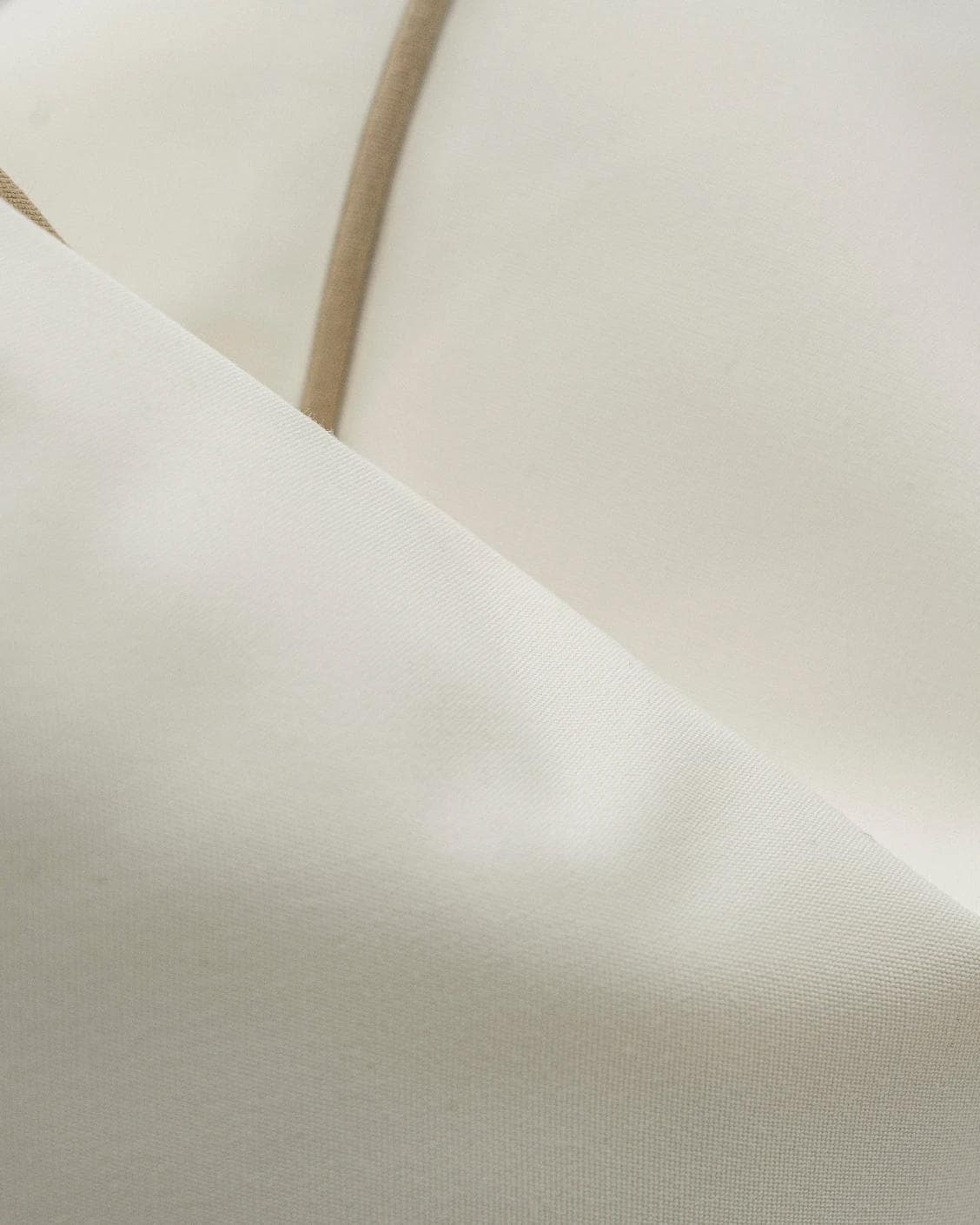 Aelia Linen cushion in ivory, shown in a product close-up as image 6