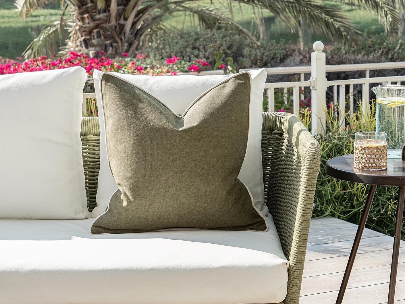Aelia Olive cushion in deep olive and green, shown in a lifestyle front view as image 4