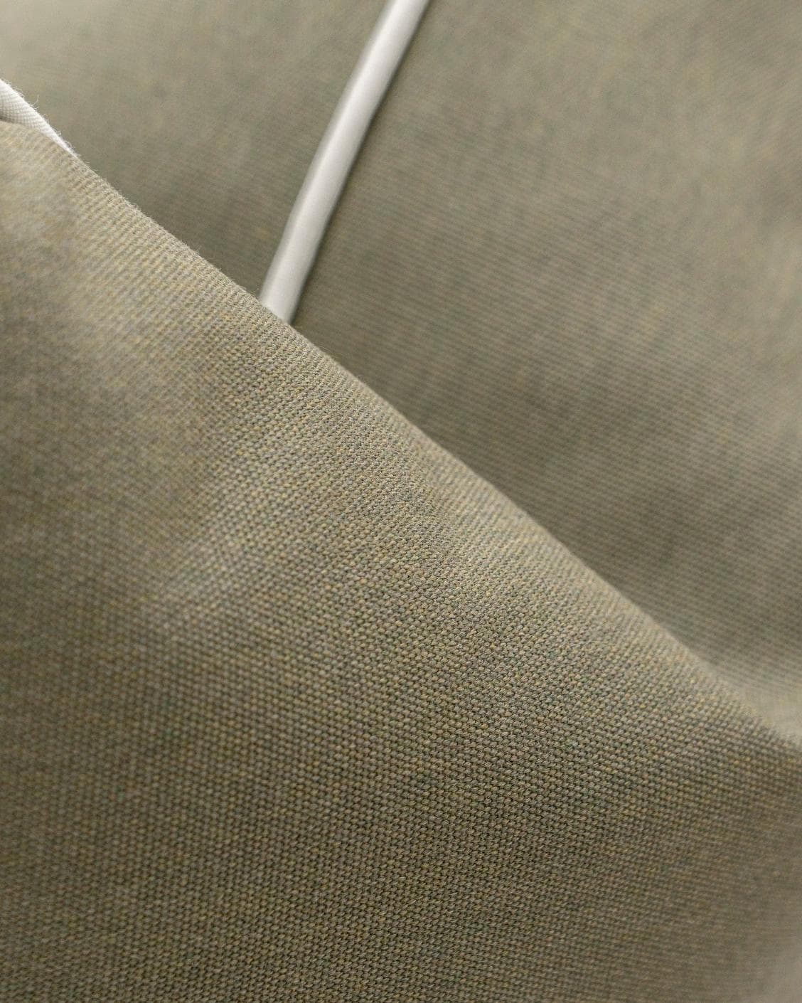 Aelia Olive cushion in deep olive and green, shown in a product close-up as image 7