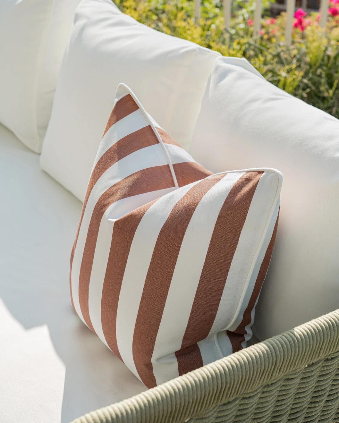 Aelia Rust cushion in ivory, shown in a lifestyle right view as image 5