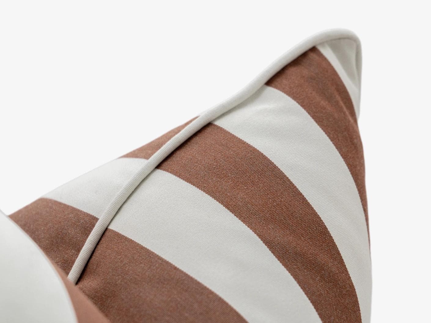 Aelia Rust cushion in ivory, shown in a product close-up as image 7
