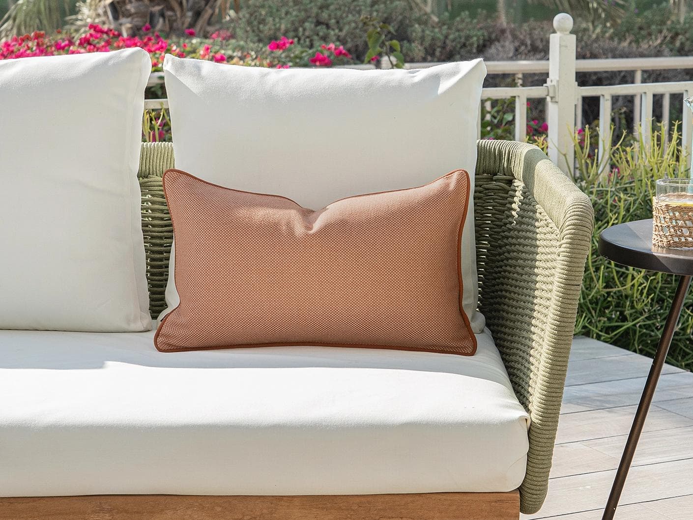 Aelia Tangelo II cushion in rust, shown in a lifestyle front view as image 4
