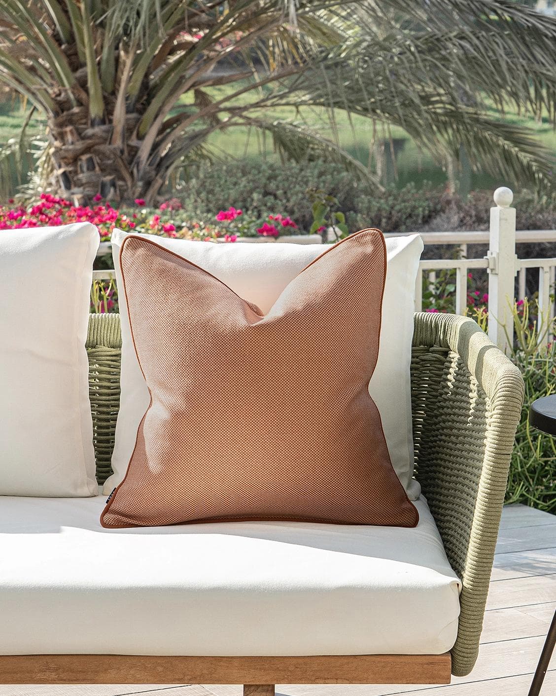 Aelia Tangelo cushion in rust, shown in a lifestyle front view as image 4