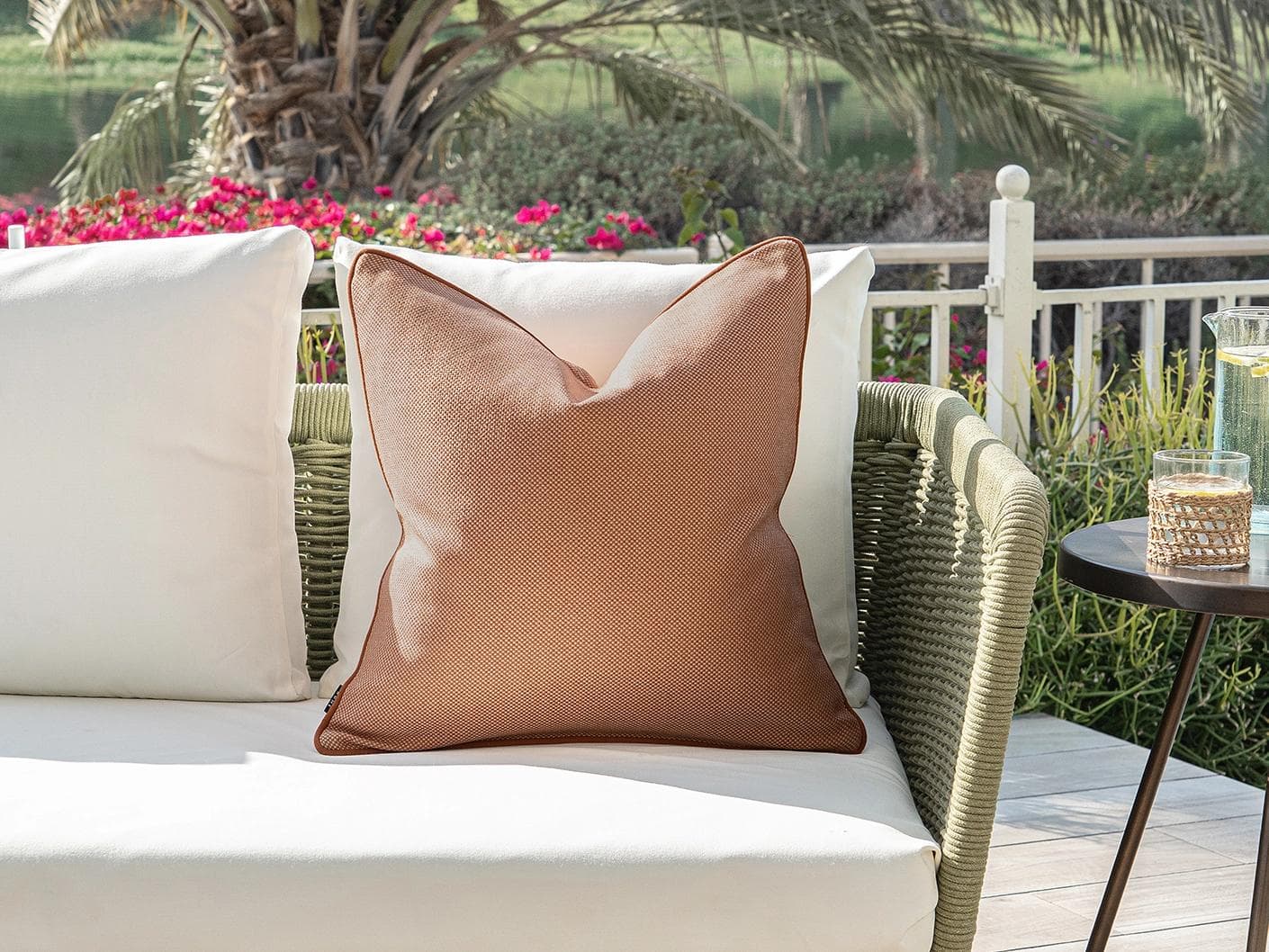 Aelia Tangelo cushion in rust, shown in a lifestyle front view as image 4