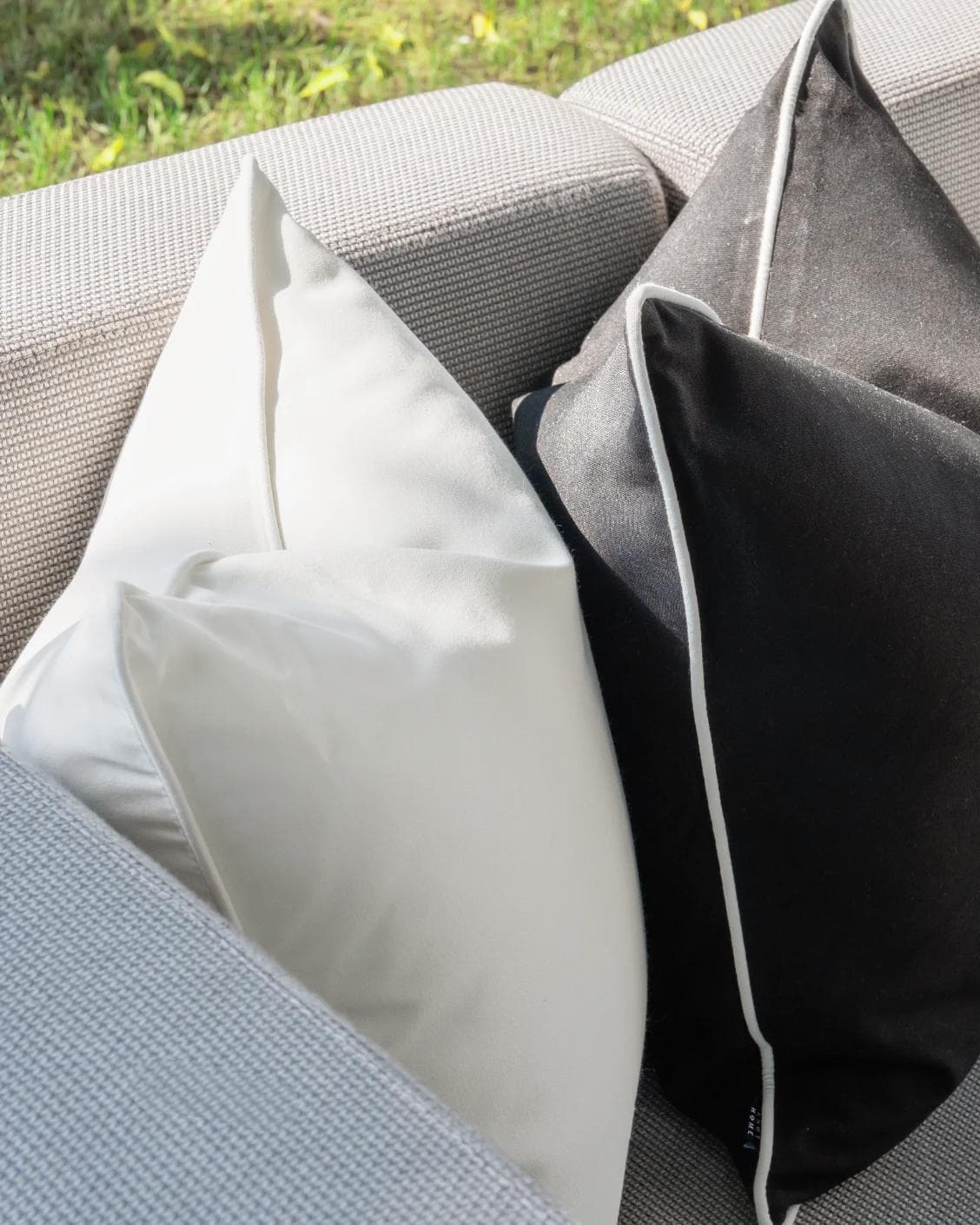 Aelius Bundle cushion in ivory, turquoise and black, shown in a lifestyle left view as image 5