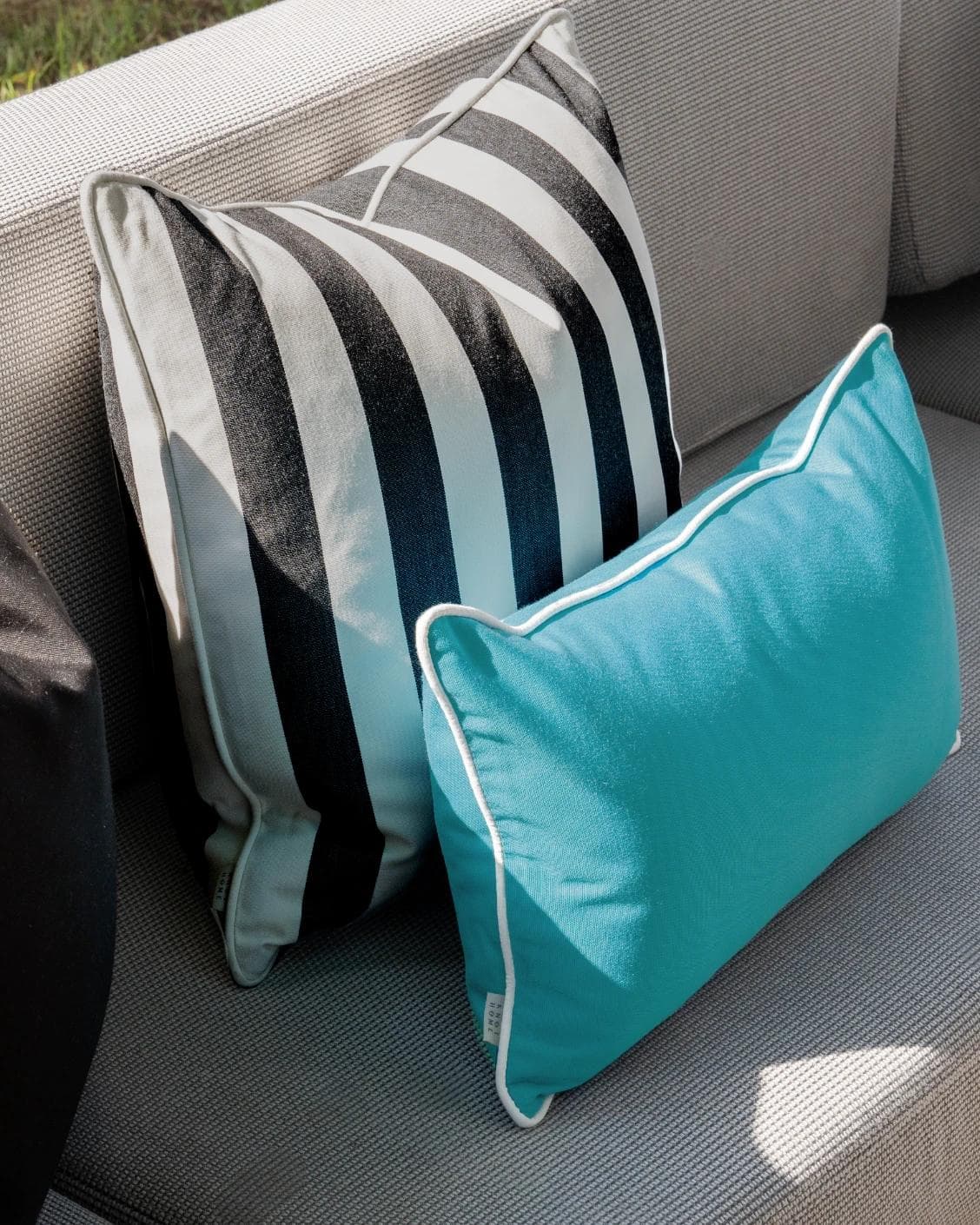 Aelius Bundle cushion in ivory, turquoise and black, shown in a lifestyle left view as image 6