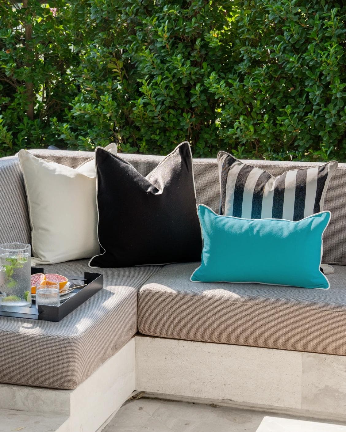 Aelius Bundle cushion in ivory, turquoise and black, shown in a lifestyle right view as image 7