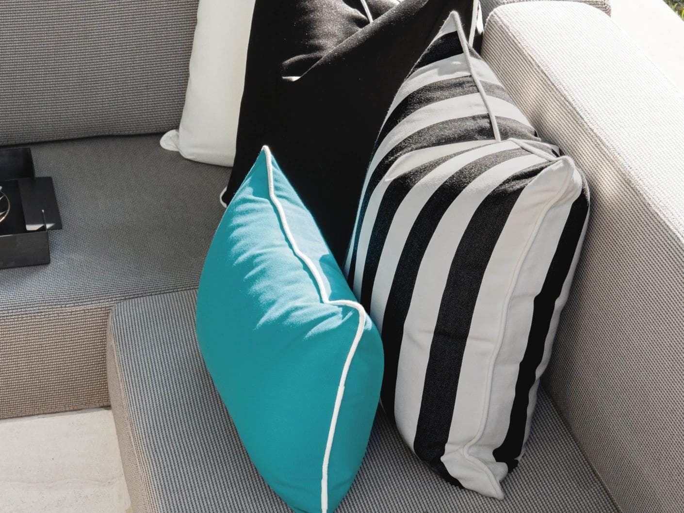 Aelius Bundle cushion in ivory, turquoise and black, shown in a lifestyle right view as image 8