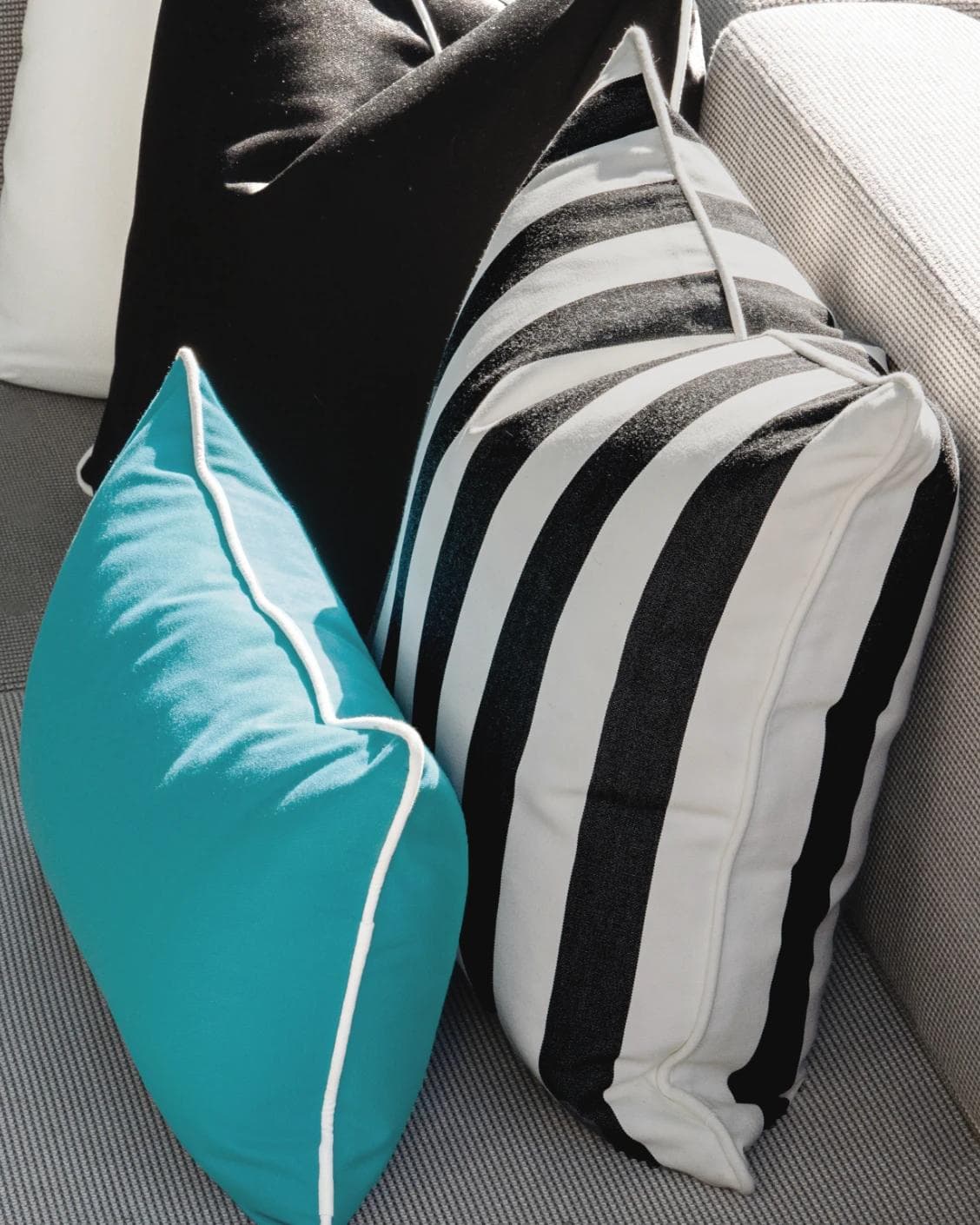 Aelius Bundle cushion in ivory, turquoise and black, shown in a lifestyle right view as image 8