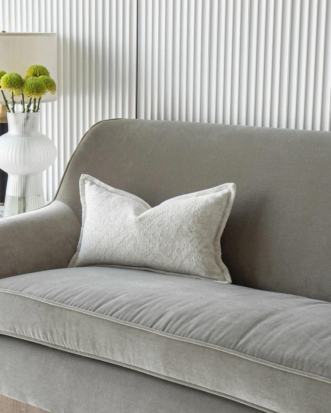 Aidan Bianca cushion in white, shown in a lifestyle front view as image 1