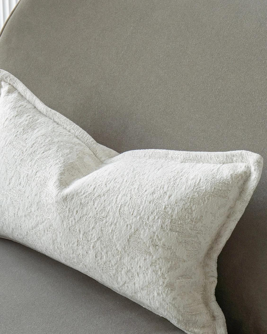 Aidan Bianca cushion in white, shown in a lifestyle top view as image 5