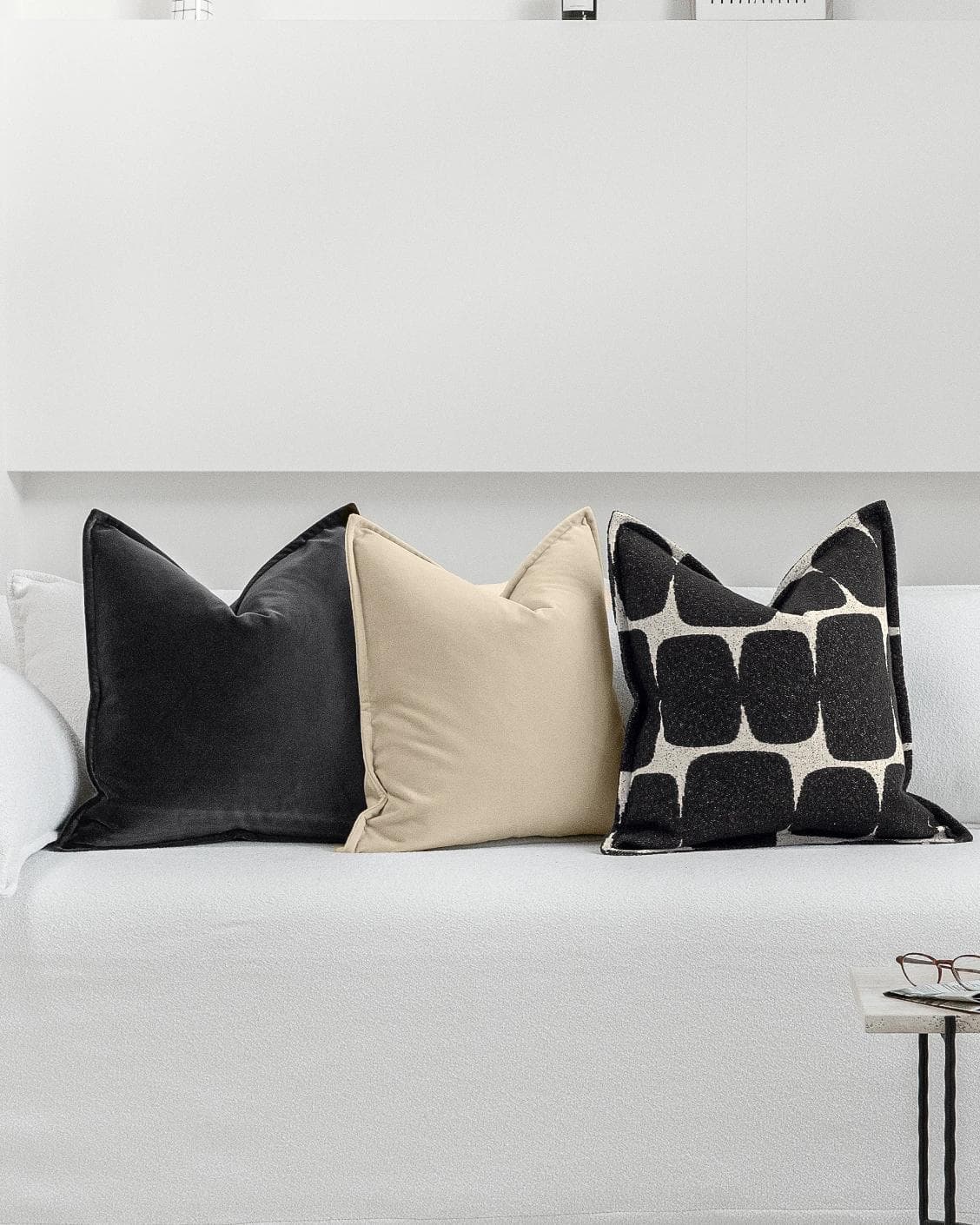 Aijan Bundle cushion in beige, grey and charcoal, shown in a lifestyle front view as image 4