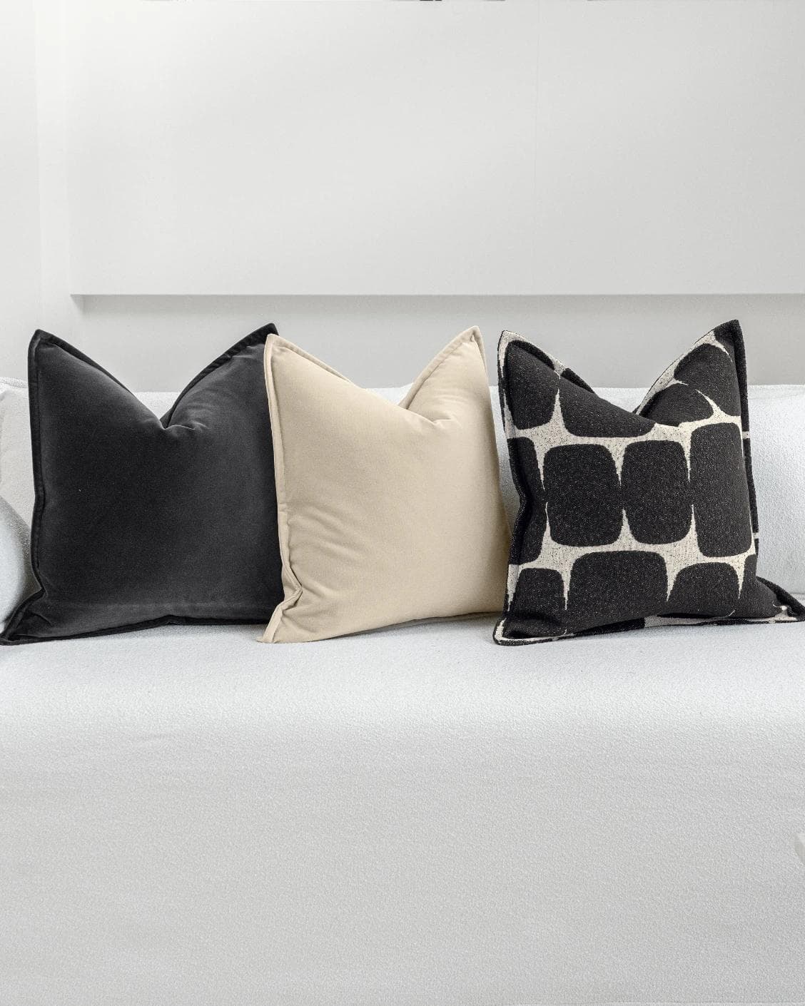 Aijan Bundle cushion in beige, grey and charcoal, shown in a lifestyle front view as image 5