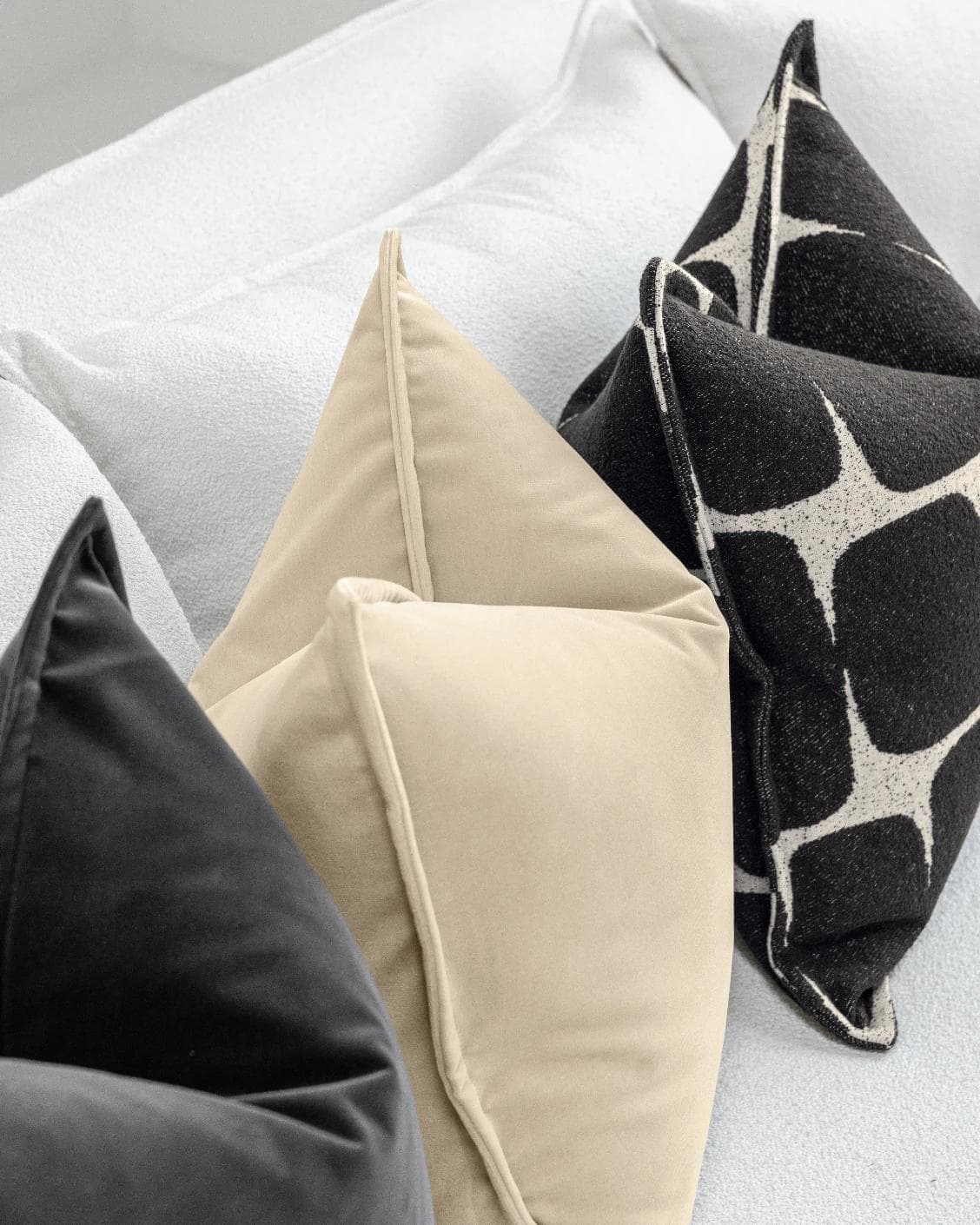 Aijan Bundle cushion in beige, grey and charcoal, shown in a lifestyle left view as image 6