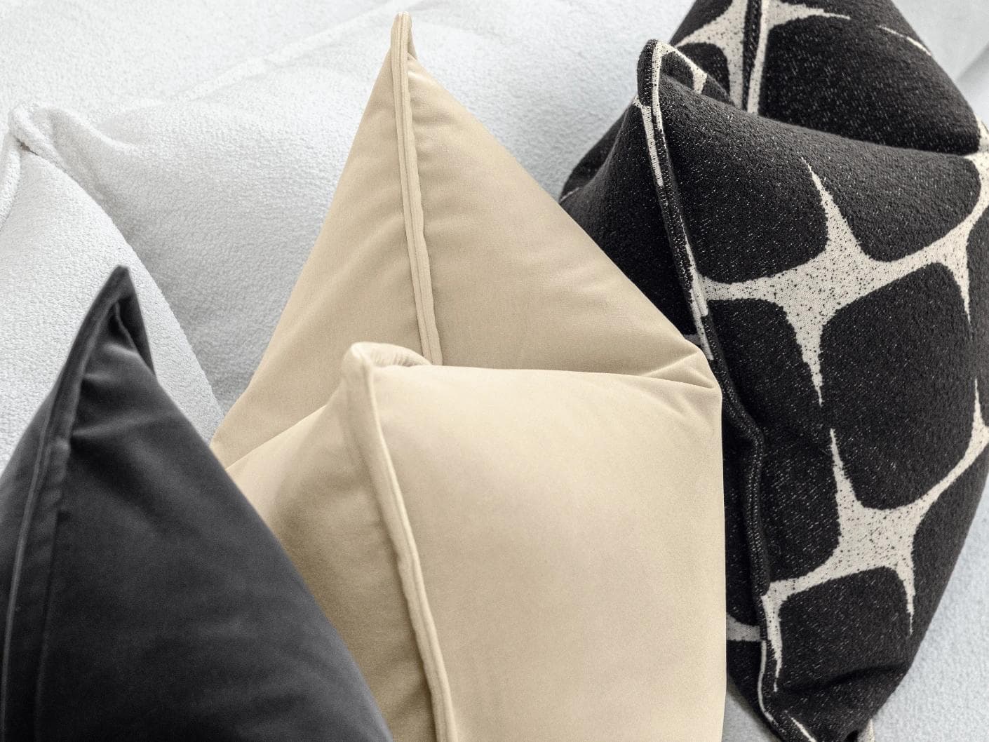 Aijan Bundle cushion in beige, grey and charcoal, shown in a lifestyle left view as image 6
