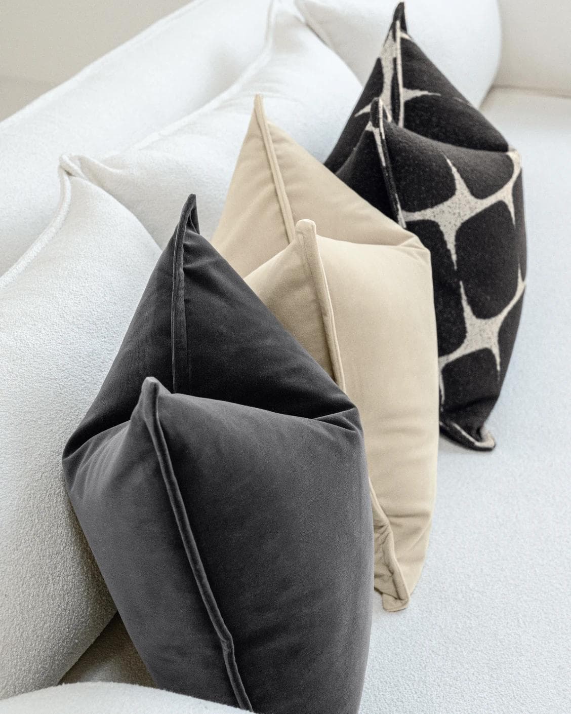 Aijan Bundle cushion in beige, grey and charcoal, shown in a lifestyle left view as image 7