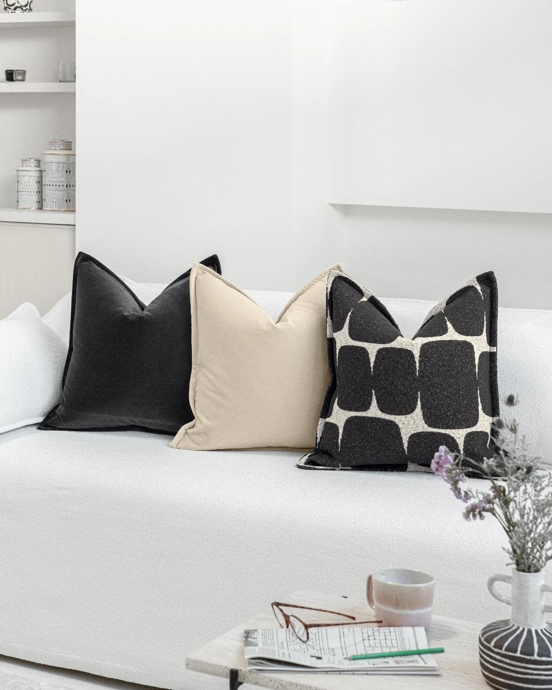 Aijan Bundle cushion in beige, grey and charcoal, shown in a lifestyle right view as image 2