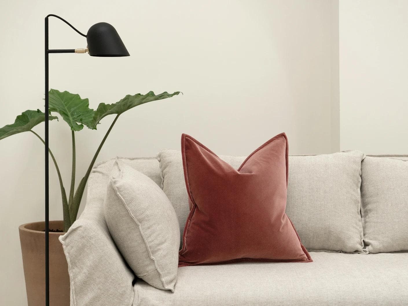 Alessandra Berry cushion in red and pink, shown in a lifestyle front view as image 4