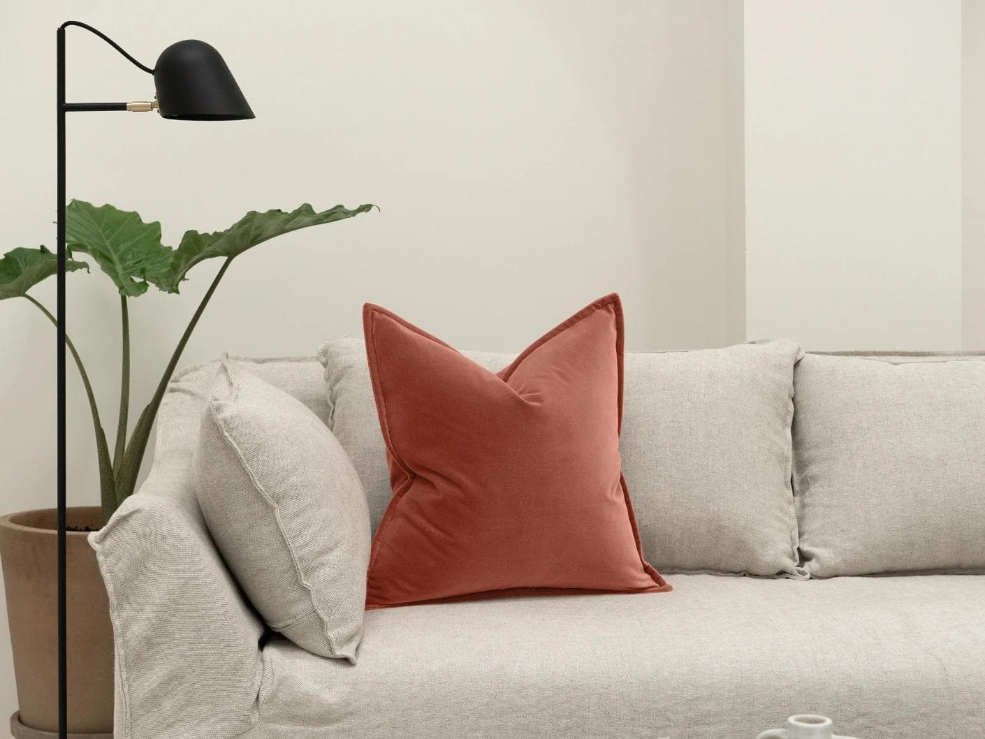 Alessandra Blush cushion in pink and red, shown in a lifestyle front view as image 4