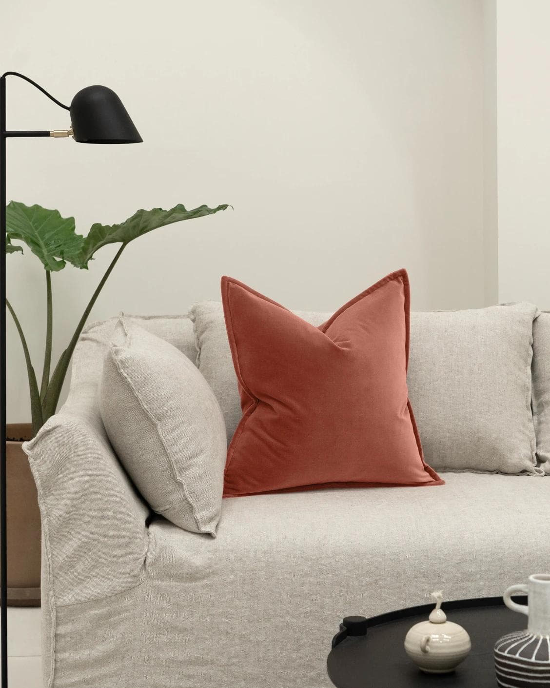 Alessandra Blush cushion in pink and red, shown in a lifestyle front view as image 4