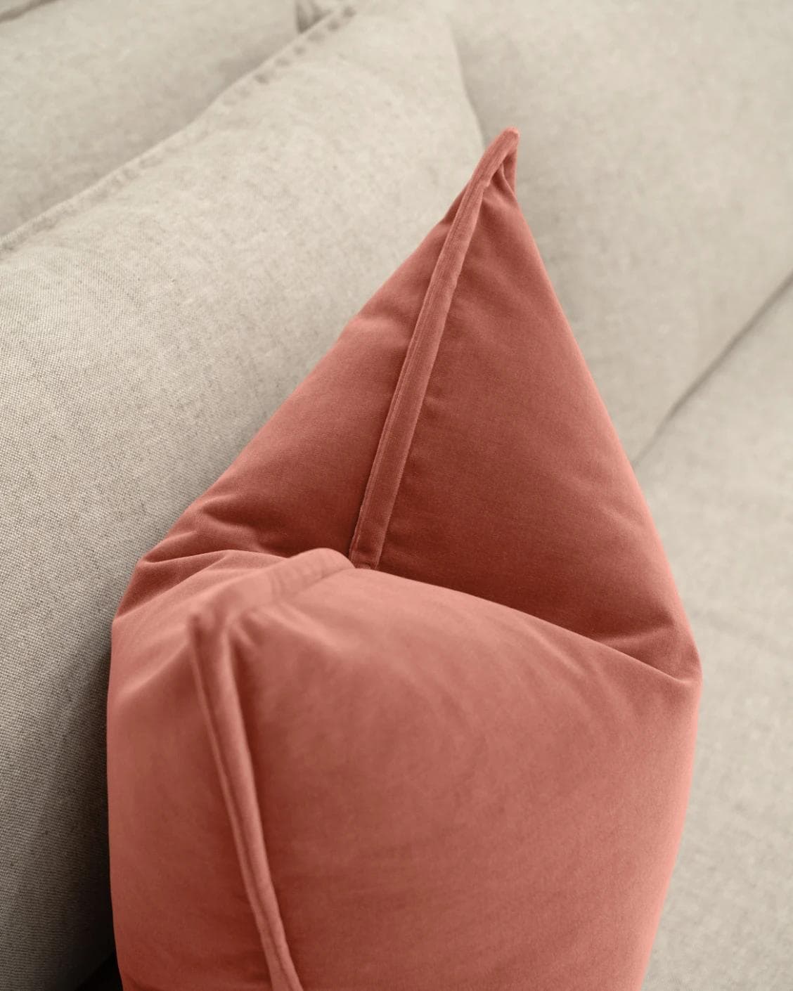 Alessandra Blush cushion in pink and red, shown in a lifestyle top view as image 5