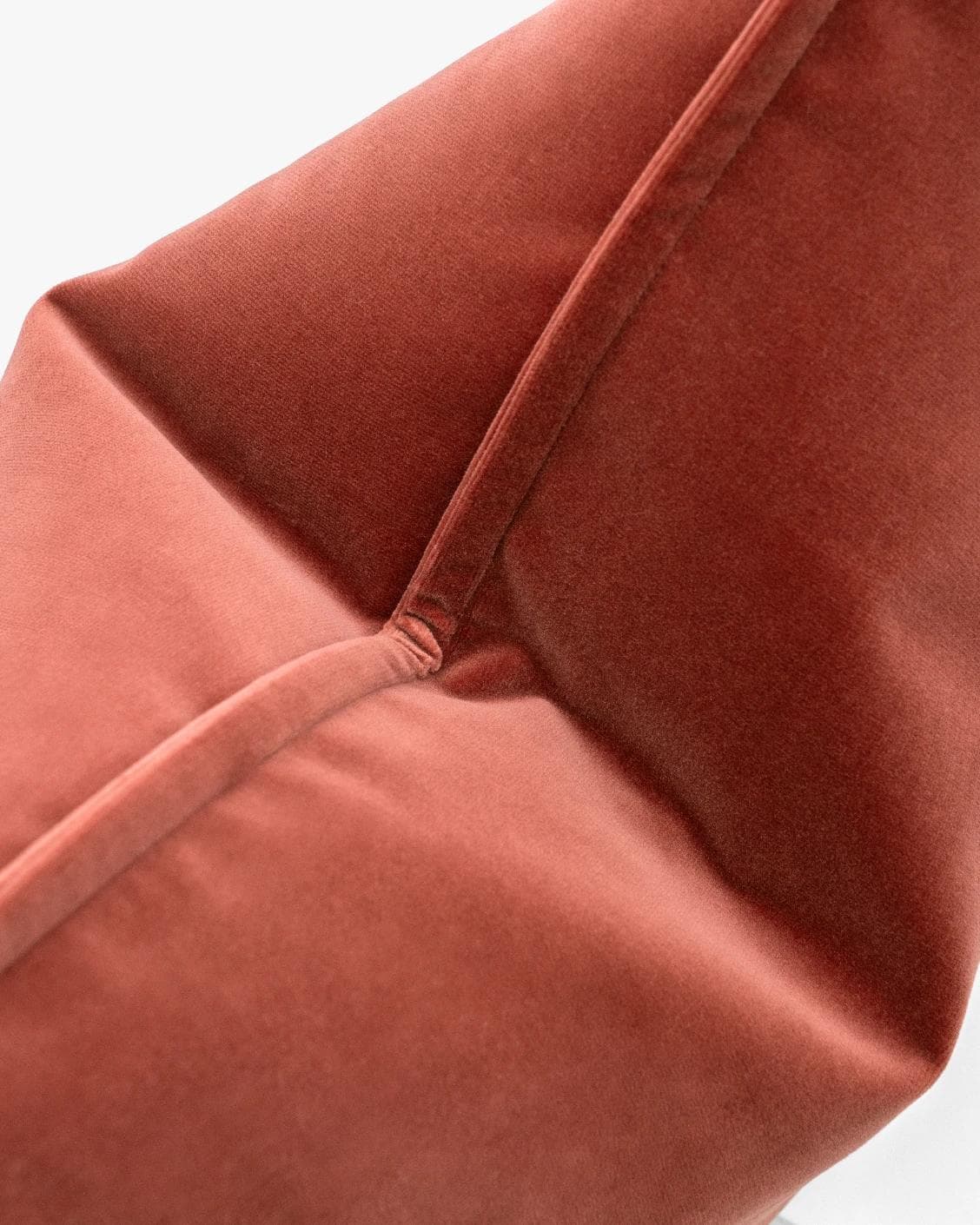 Alessandra Blush cushion in pink and red, shown in a lifestyle top view as image 6