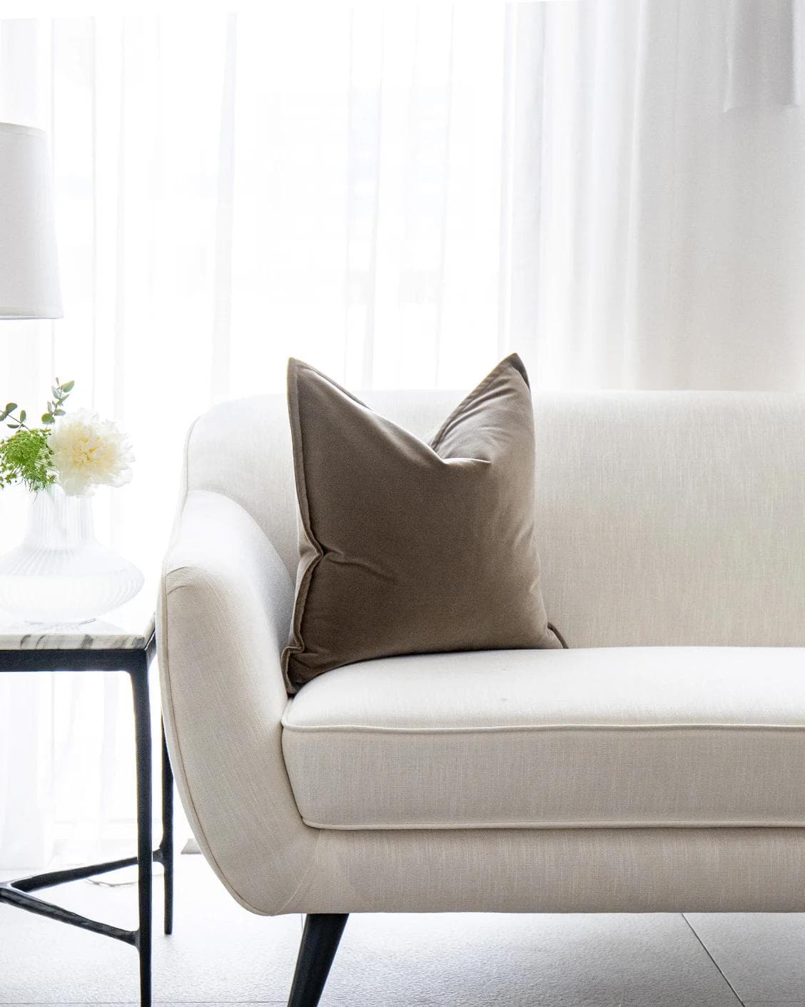 Alessandra Braun cushion in brown, shown in a lifestyle front view as image 4