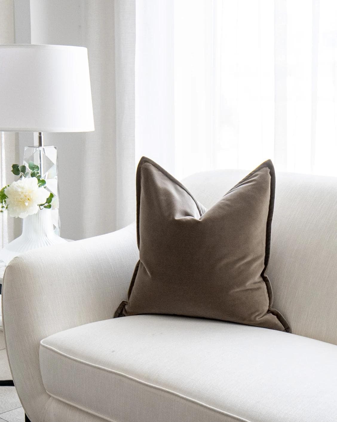 Alessandra Braun cushion in brown, shown in a lifestyle right view as image 2