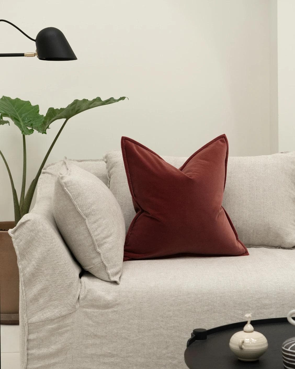 Alessandra Cherry cushion in red, shown in a lifestyle front view as image 4