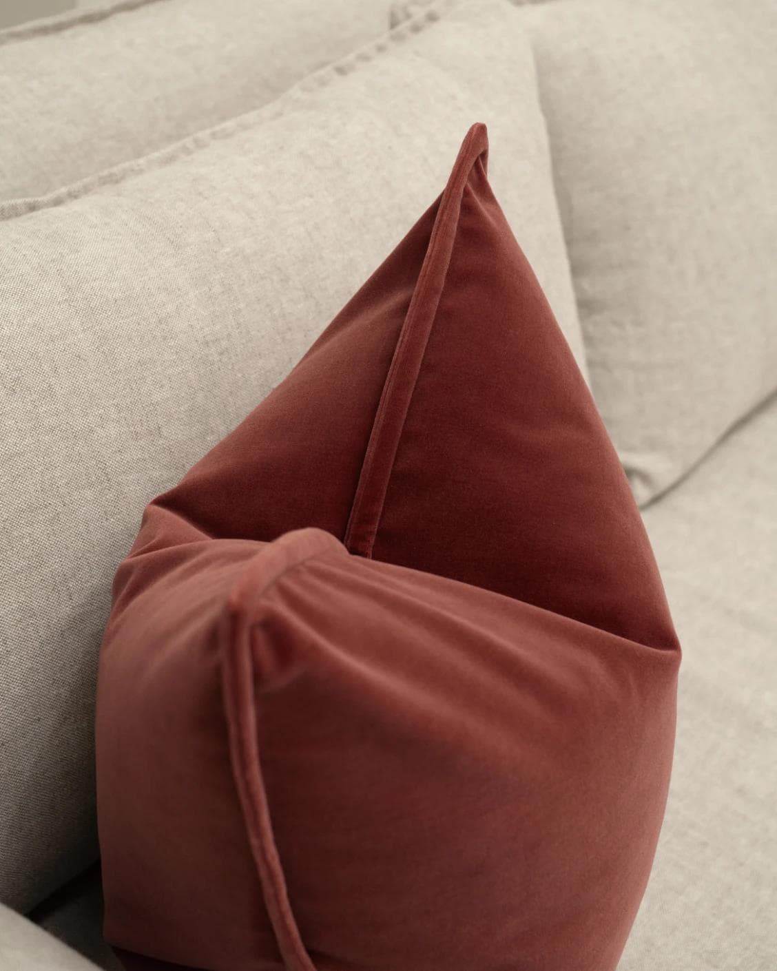 Alessandra Cherry cushion in red, shown in a lifestyle left view as image 5
