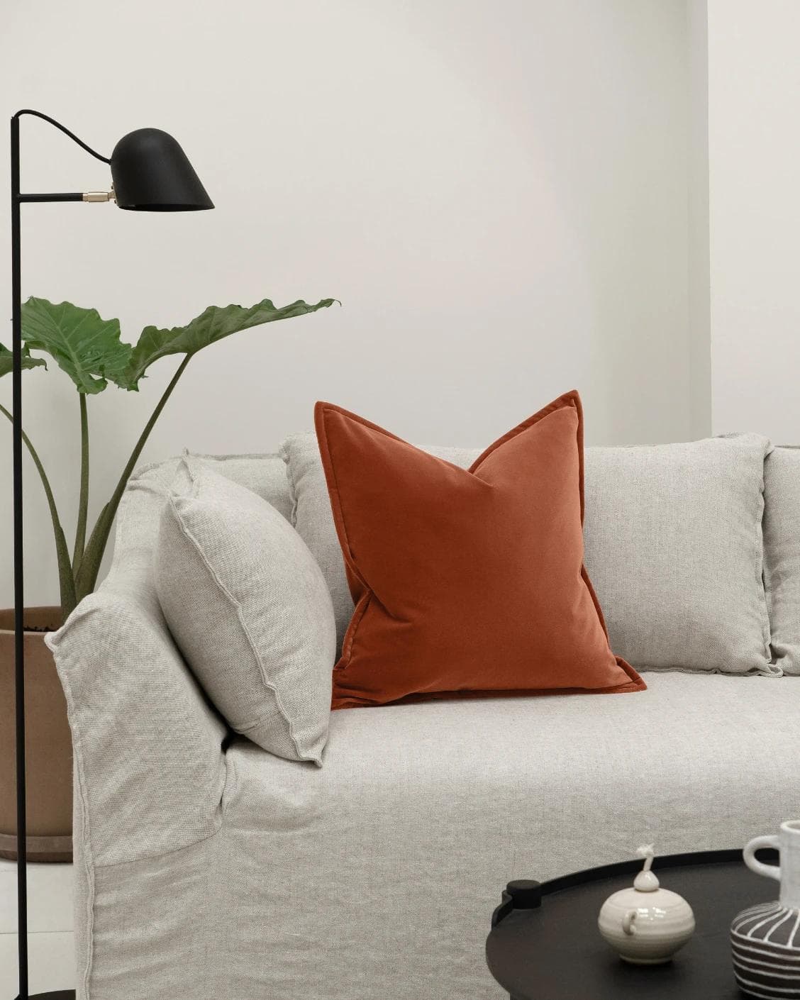Alessandra Crimson cushion in orange, shown in a lifestyle front view as image 4