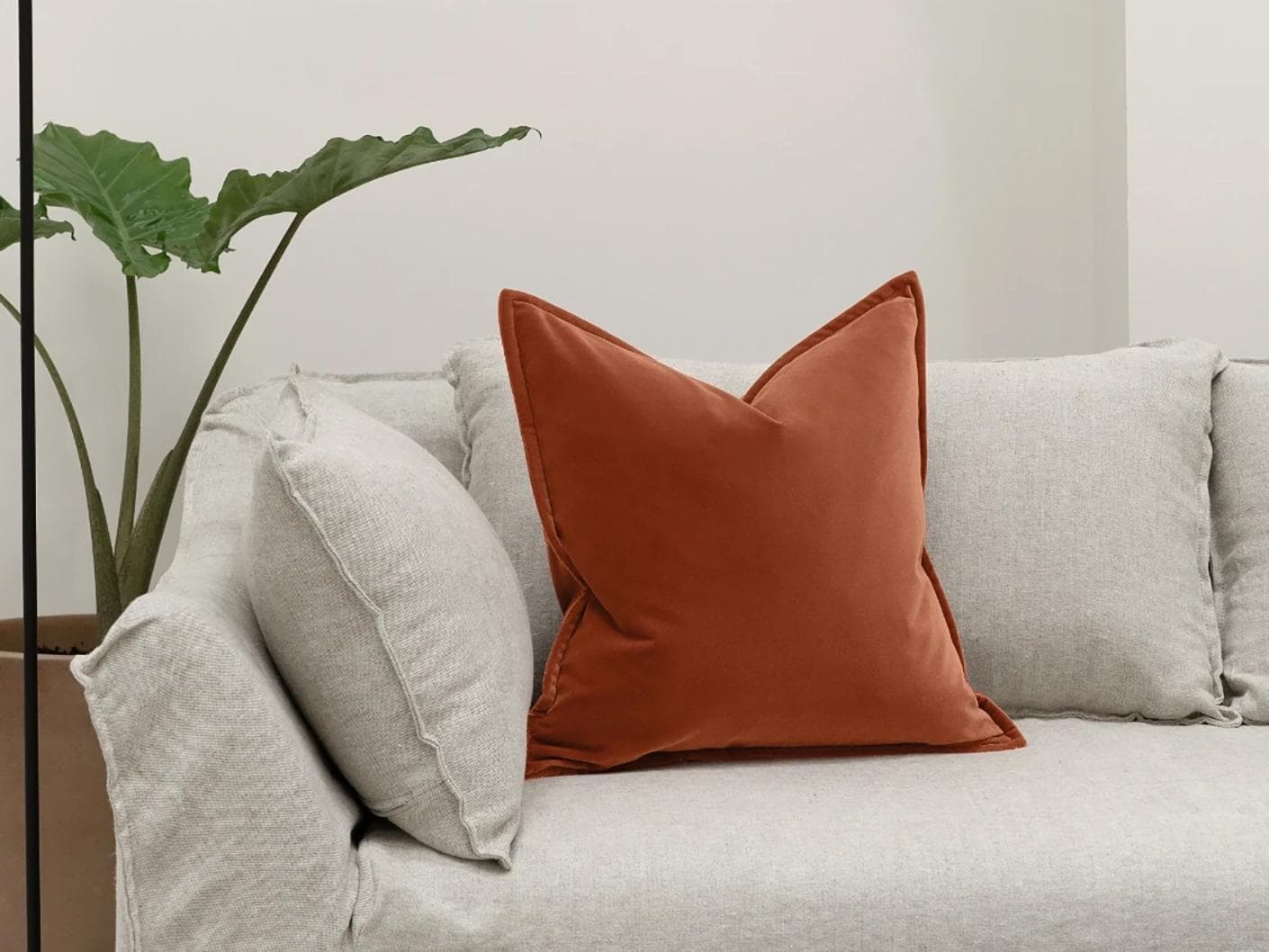 Alessandra Crimson cushion in orange, shown in a lifestyle front view as image 4