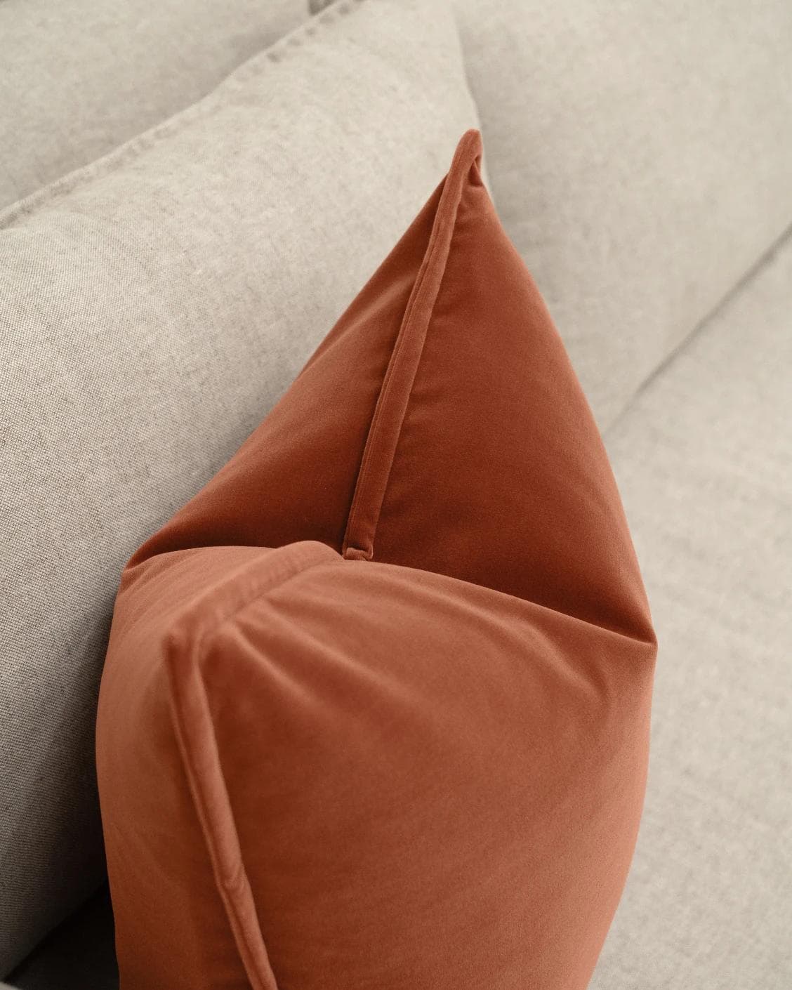 Alessandra Crimson cushion in orange, shown in a lifestyle top view as image 5
