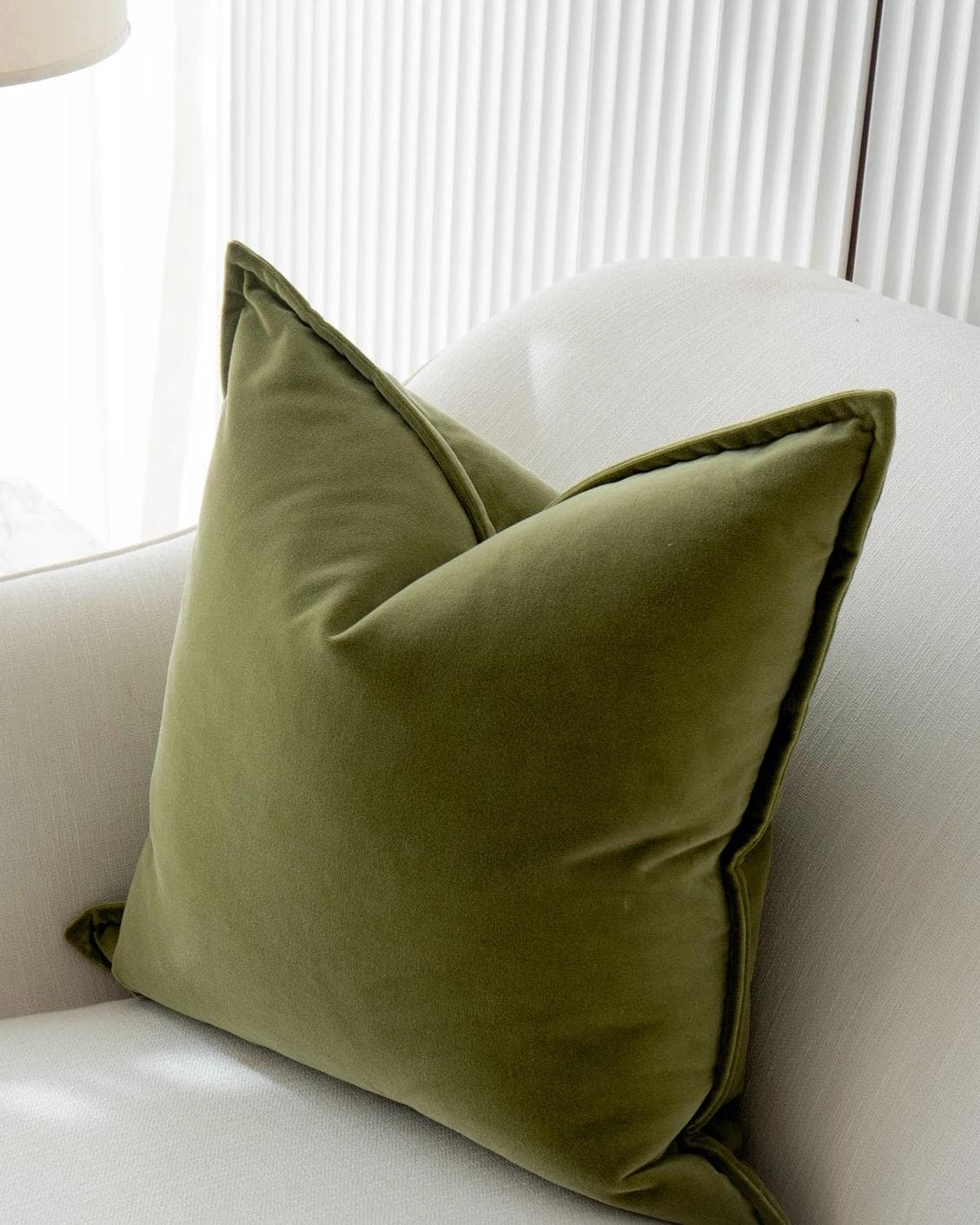 Alessandra Jade cushion in green, shown in a lifestyle top view as image 5