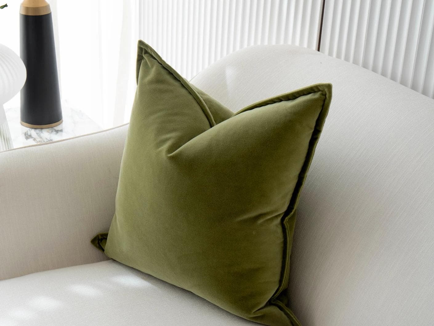 Alessandra Jade cushion in green, shown in a lifestyle top view as image 5