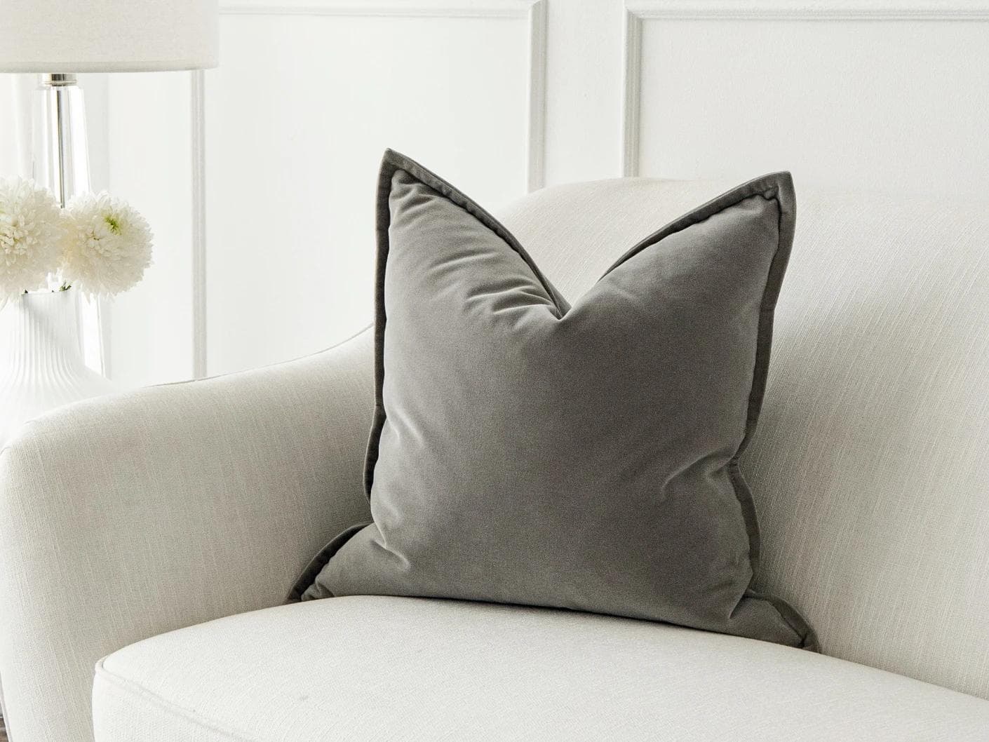Alessandra Laurent cushion in grey, shown in a lifestyle front view as image 1