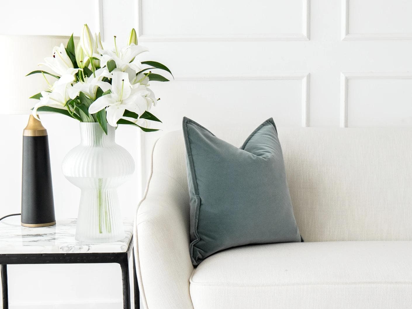 Alessandra Lucas cushion in pastel blue and blue, shown in a lifestyle front view as image 4