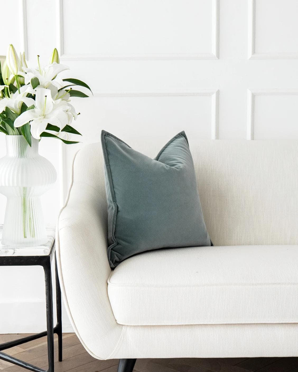 Alessandra Lucas cushion in pastel blue and blue, shown in a lifestyle front view as image 4
