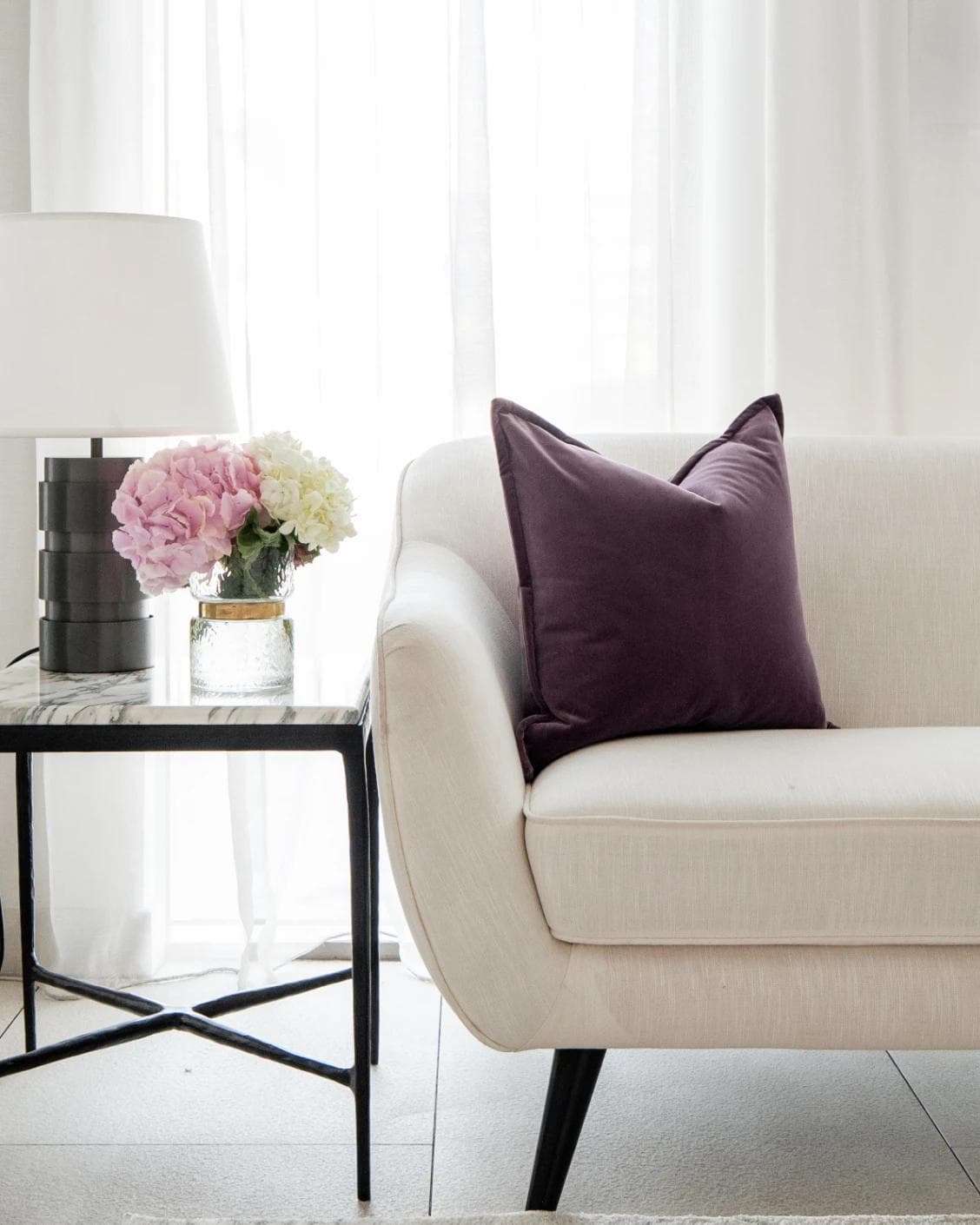 Alessandra Mauveine cushion in purple, shown in a lifestyle front view as image 4