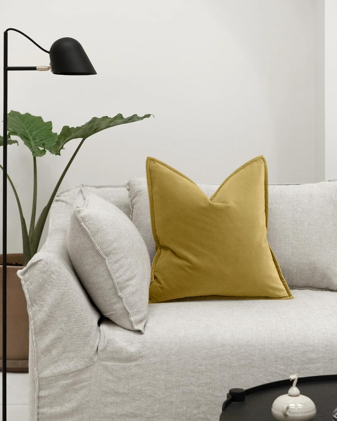 Alessandra Moss cushion in gold, shown in a lifestyle front view as image 4