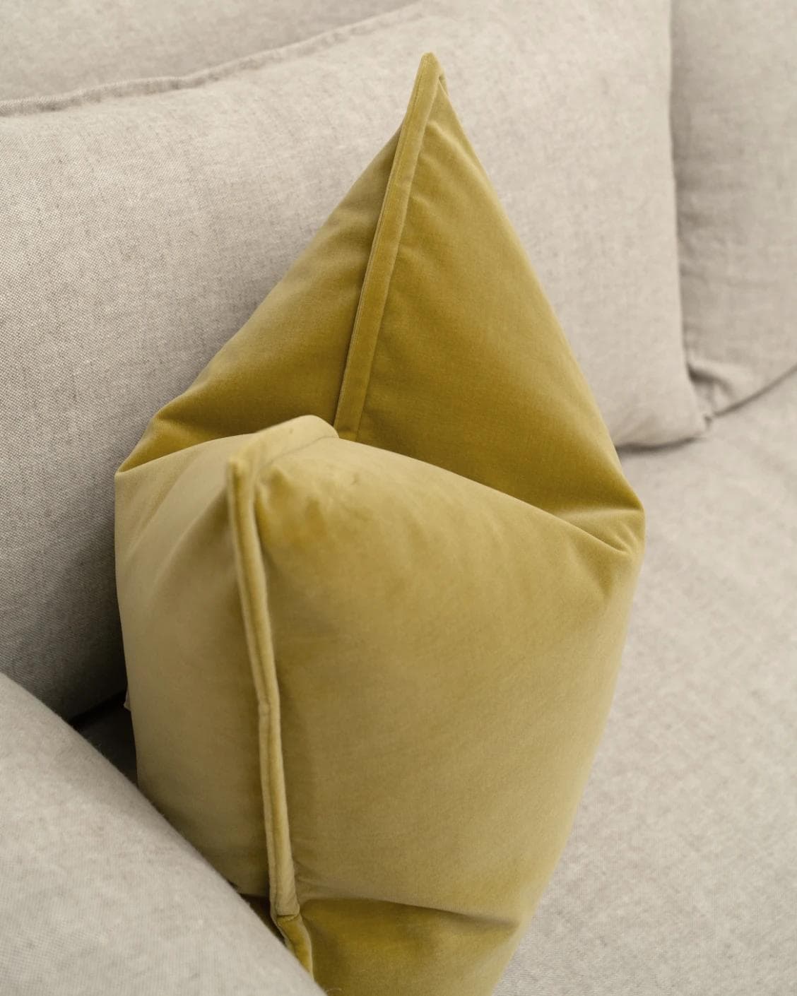 Alessandra Moss cushion in gold, shown in a lifestyle top view as image 5
