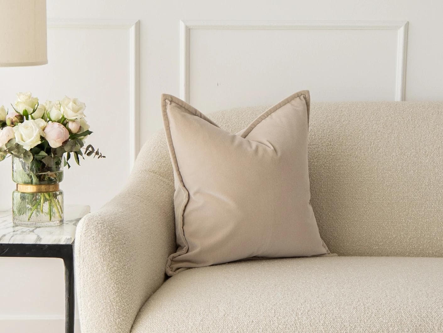 Alessandra River cushion in beige, shown in a lifestyle front view as image 1