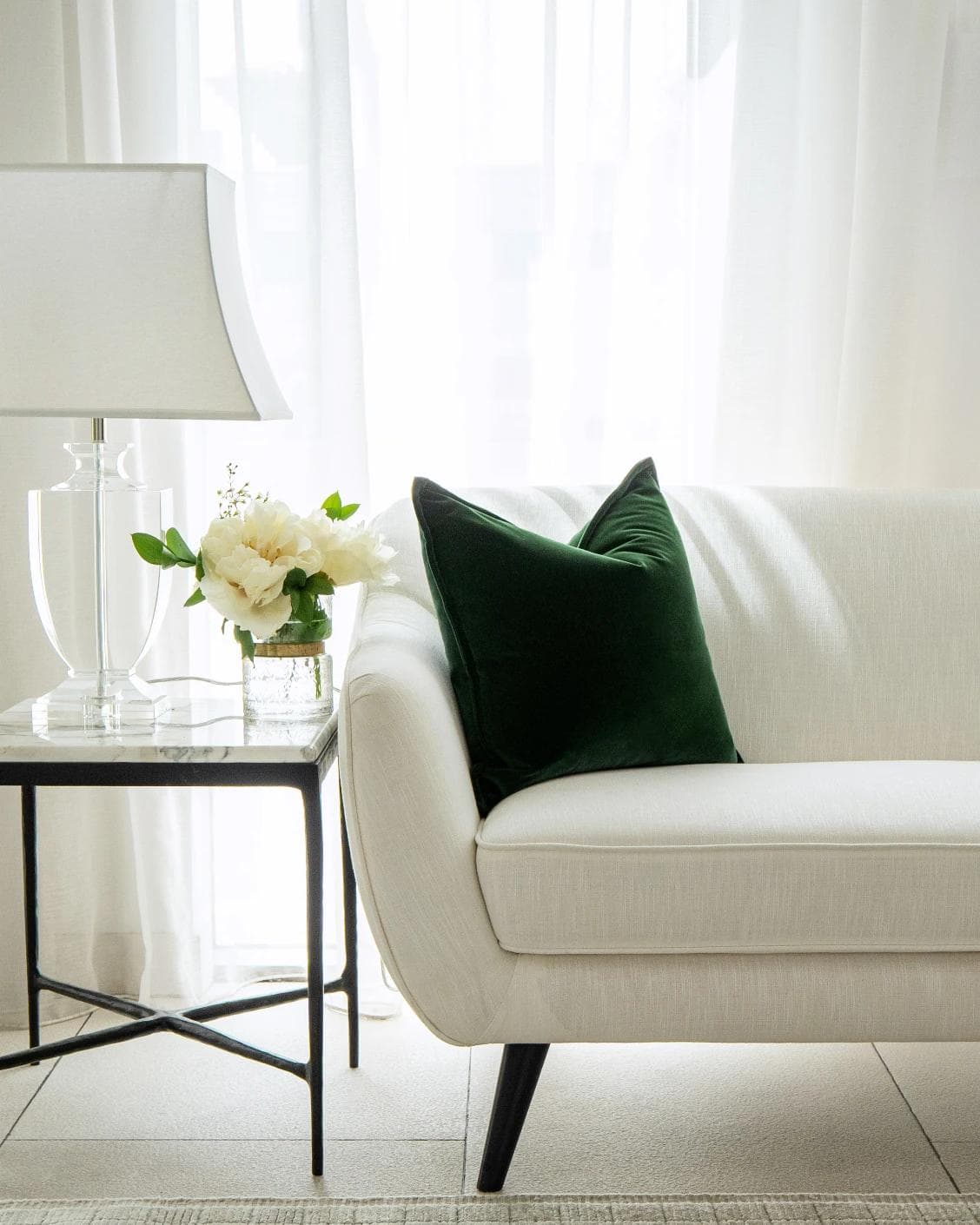 Alessandra Russel cushion in dark green and green, shown in a lifestyle front view as image 4