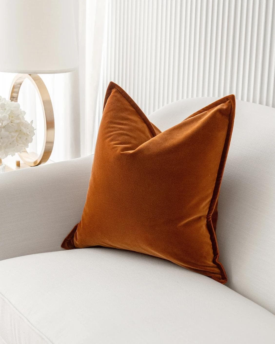 Alessandra Rust cushion in orange, shown in a lifestyle right view as image 2