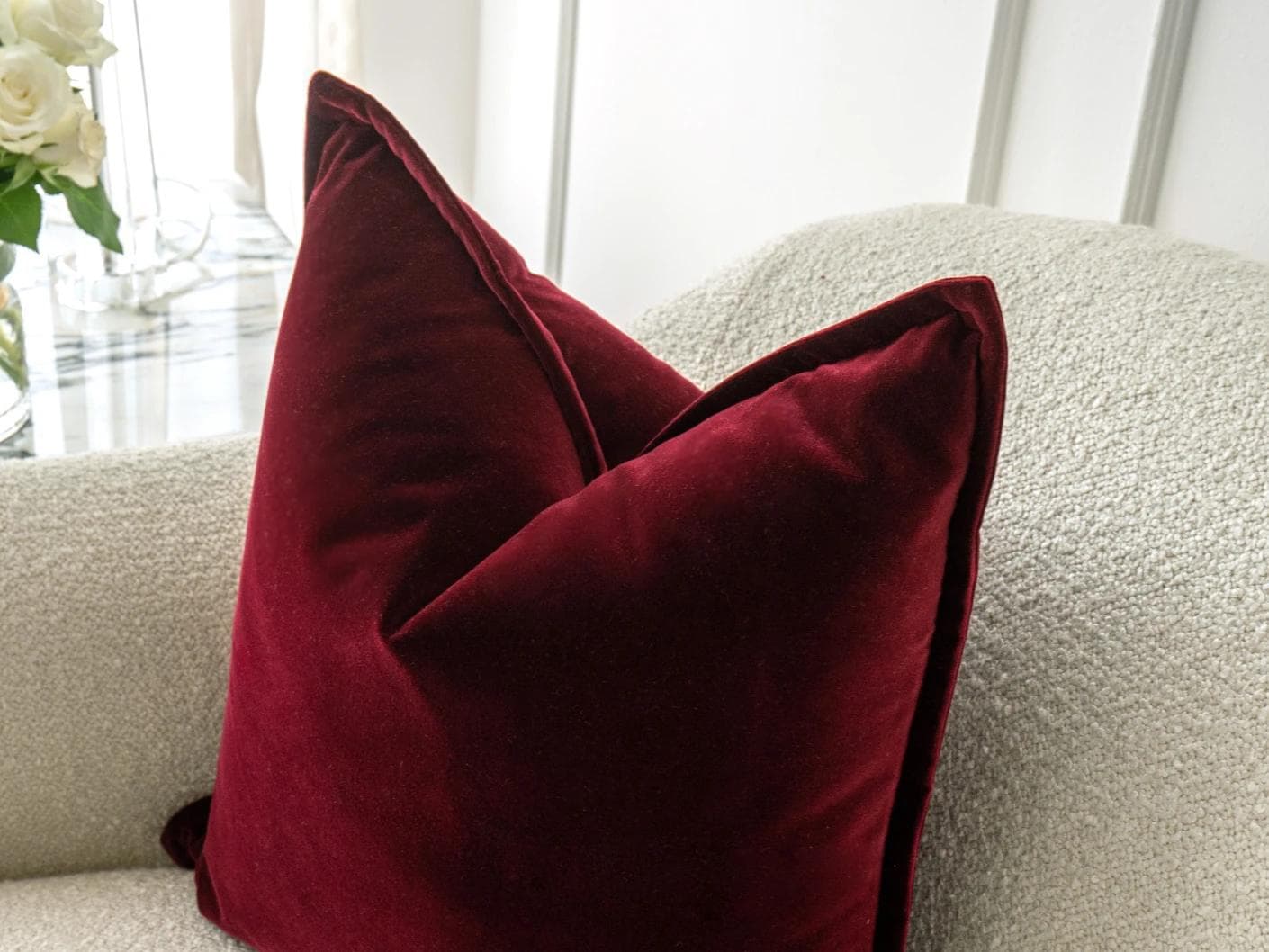 Alessandra Scarlet cushion in red, shown in a lifestyle top view as image 5