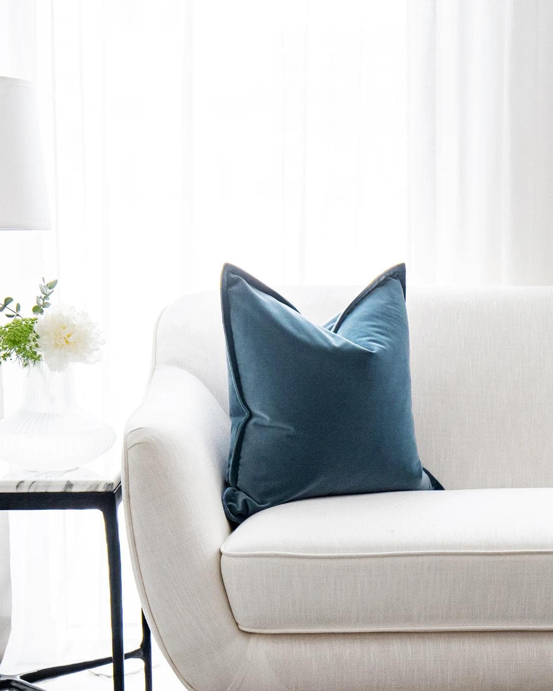 Alessandra Sky cushion in blue, shown in a lifestyle front view as image 1