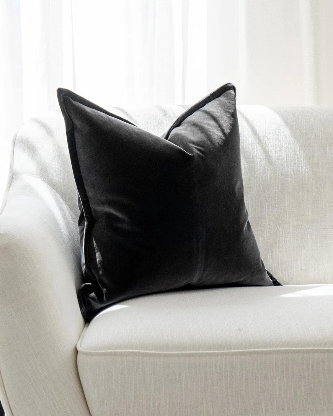 Alessandra Steele cushion in charcoal and grey, shown in a lifestyle front view as image 6